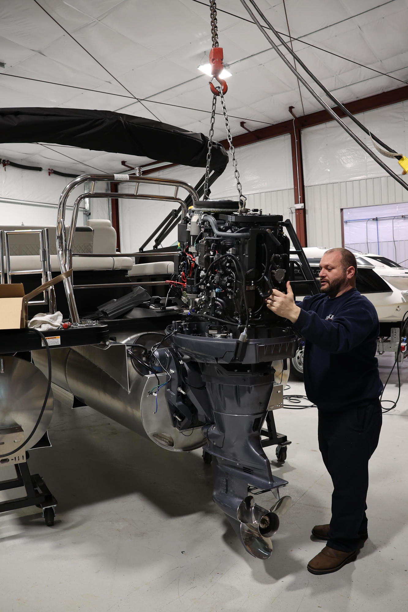 Boat Service Boat Mechanics Boat Repair Lake George Dimond Point A Tech working on an engine 